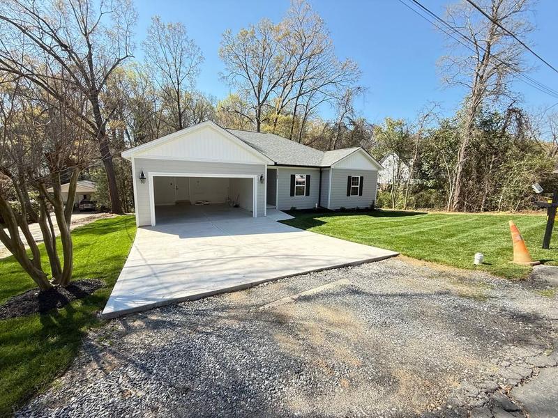 New construction home with a fresh, fully established lawn